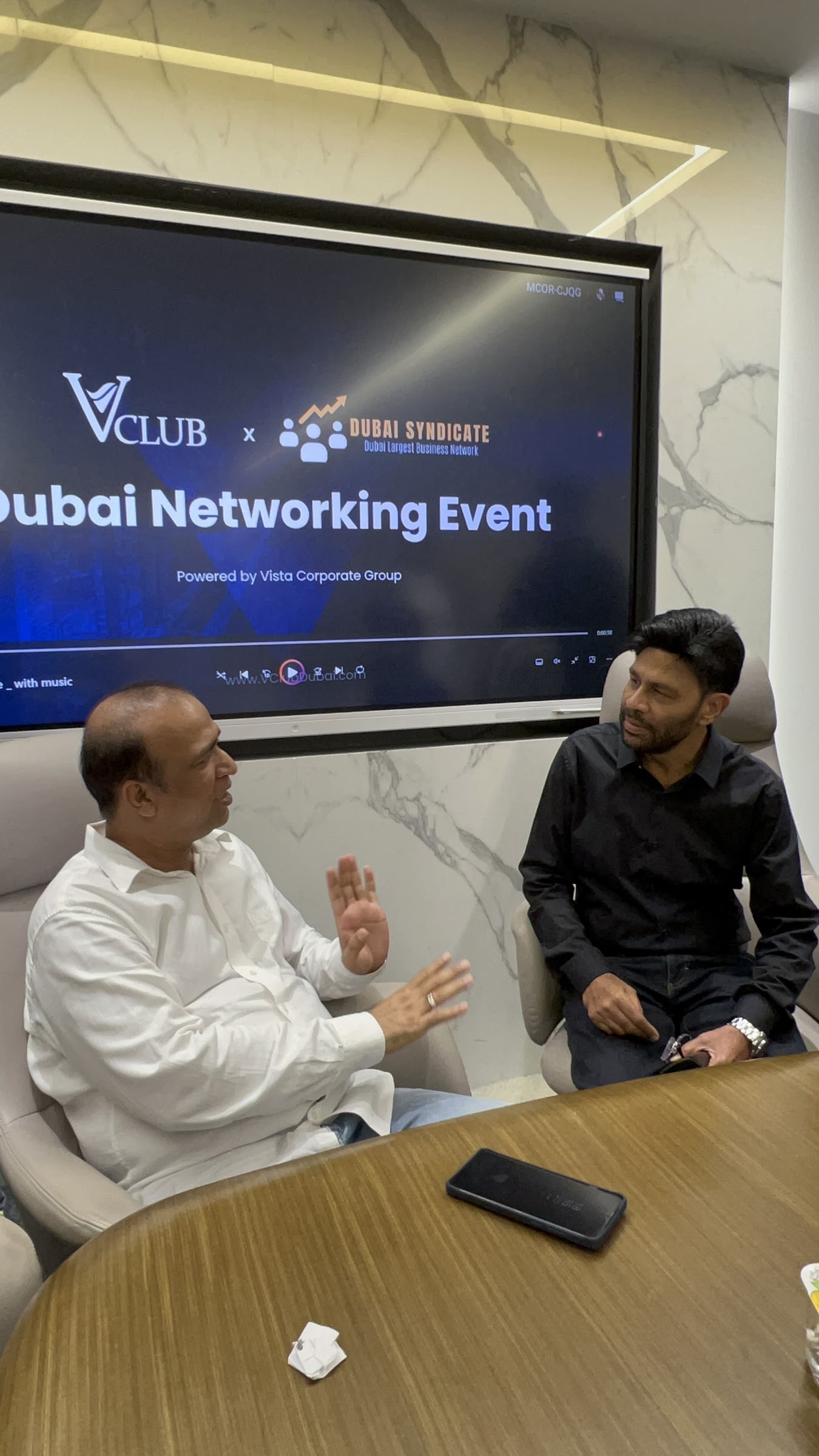 Participants in conversation at a Dubai Syndicate networking event